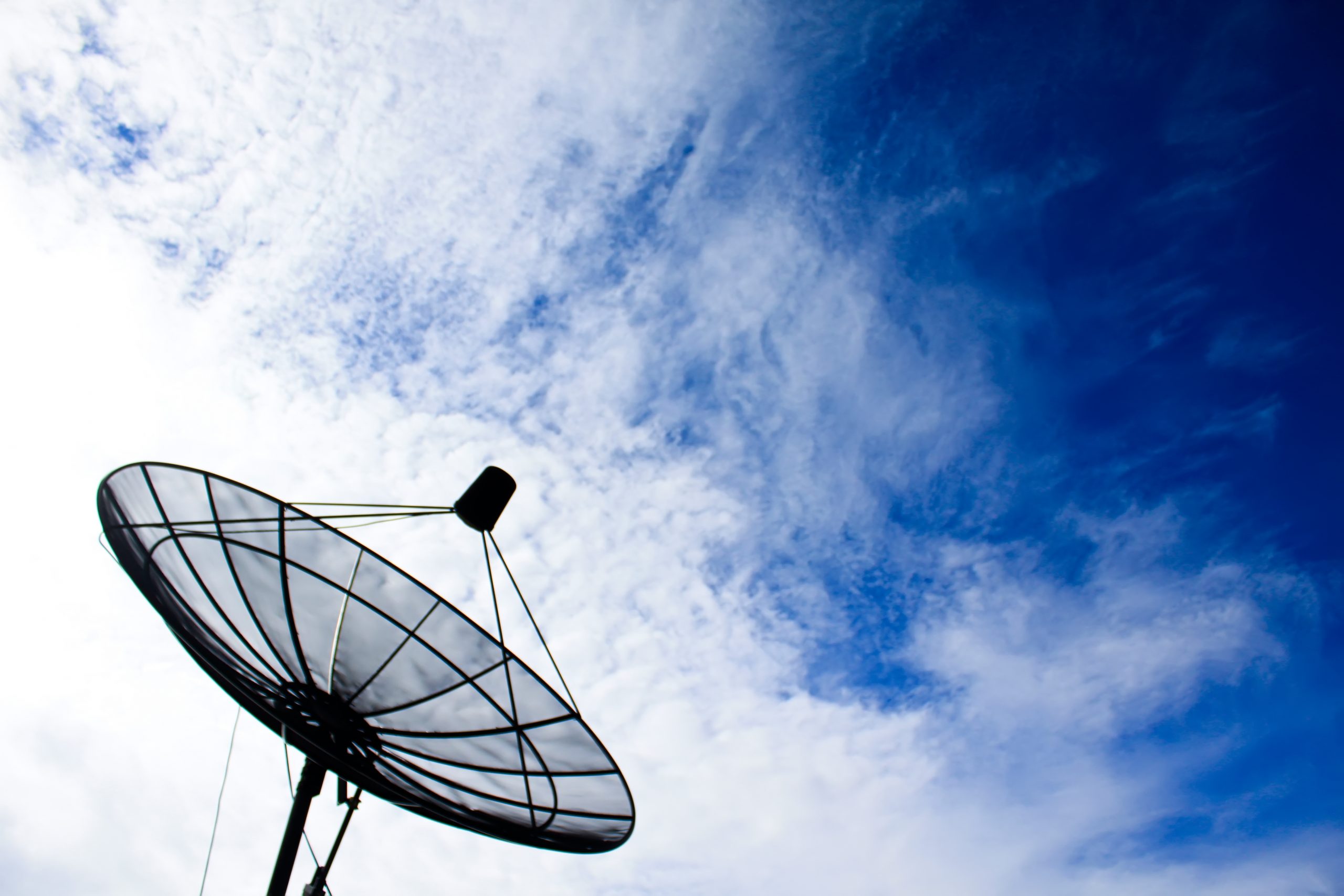 Satellite dish with blue sky.